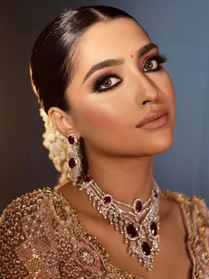 A regal reception look with a soft, smokey eye and ruby jewelry. I teach how to create a look that is glamorous and impactful, perfect for the final wedding event.