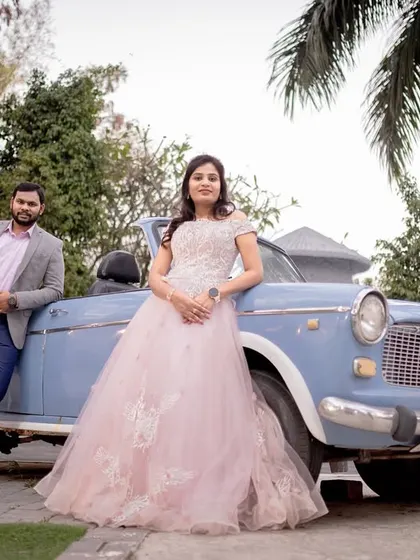 A classic, vintage-themed shot featuring an old-fashioned car. This is a great way to add character and a storyline to your pre-wedding photos.