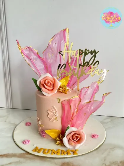 A beautiful cake for "Mummy," featuring soft pink tones, abstract sails, and delicate roses.