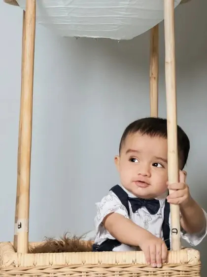 A dapper little boy looking thoughtful in our hot air balloon.