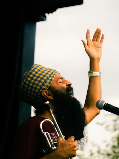 A moment of pure passion from Sonny Singh during his trumpet solo. The live artist collaborations are what elevate the party into a full concert experience.