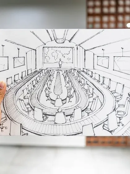 Every great design starts with a sketch. This is the initial concept drawing for the large conference hall, where we first explored the layout and architectural elements.