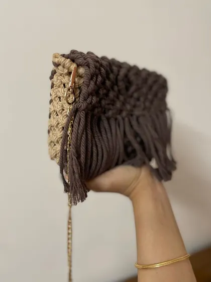 Here you can see the side view of the brown and beige sling bag, showing how it's constructed. I use two colors to give it a unique look.