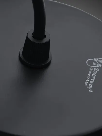 A close-up of the base of our pendant light, showing the quality construction and branding.