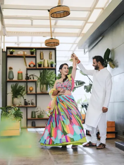 The bride twirls in her stunning, multi-colored lehenga during her Mehendi function. I work with you to ensure every element, from decor to your outfits, comes together beautifully.