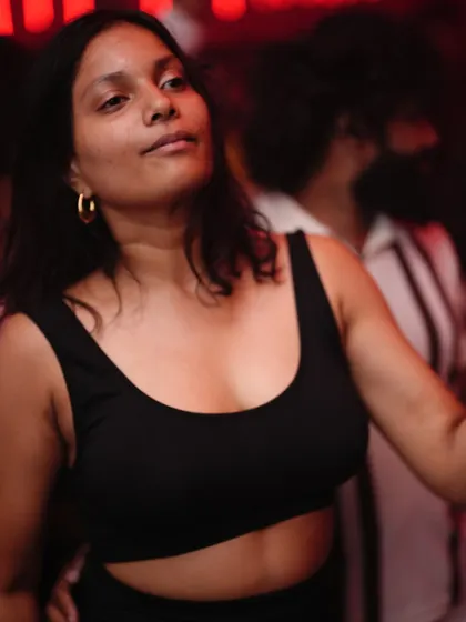 A cool and confident dancer enjoying the night.