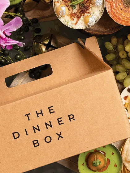 A close-up of our branded Dinner Box, a symbol of the gourmet experience that awaits you.