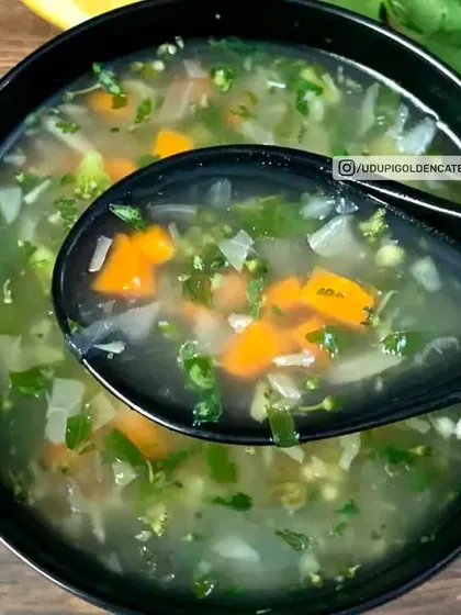 A light and refreshing Lemon Coriander Soup, filled with finely chopped vegetables. This clear soup is a healthy and zesty option to begin a meal.