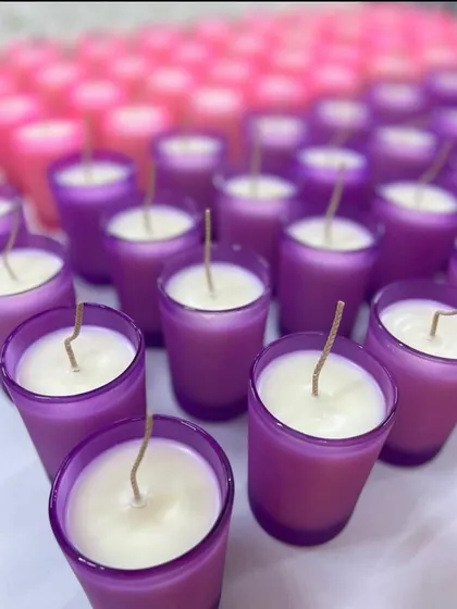 We can customize our candles to match any wedding theme. These shot glass candles were made in purple and pink for a colorful celebration.