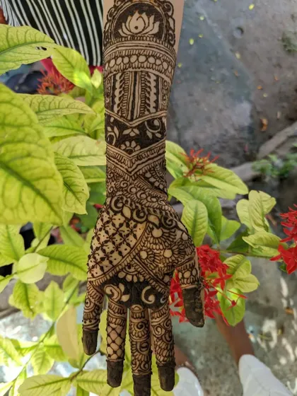 A duplicate image of the full-hand design with the lotus motif.