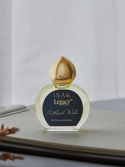 Another composition for Isak Legacy's "A Royal Wyld" perfume oil. This desktop scene with a notebook and soft morning light gives the product a gentle, sophisticated, and personal feel.