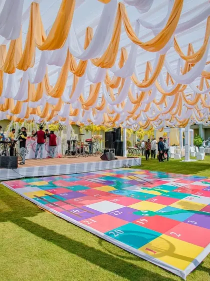 Another view of the giant snakes and ladders game, ready for guests to play during the daytime festivities.