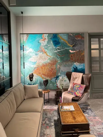 The oversized abstract painting as the centerpiece of an office lounge. My goal with large commissions is to create art that not only fills a wall but also defines the mood and character of the space.