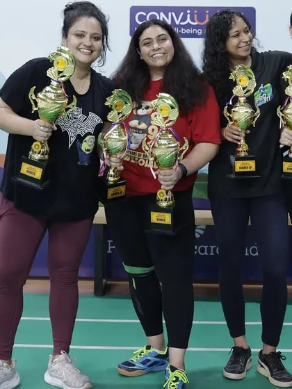 Celebrating the winners of the women's category at the Pernod Ricard India tournament. I ensure our events have diverse categories, including singles, doubles, and mixed doubles, so every employee gets a chance to compete and shine.