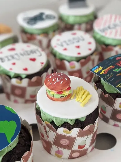 Another look at the variety in a custom cupcake box. I can create toppers for any theme, including TV shows, cars, and personal messages.