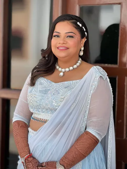 A full portrait of the bride, her outfit and styling perfect for a daytime party.
