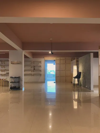Another perspective of our studio, showing the clean lines and thoughtful layout. Every detail, from the lighting to the polished floors, was chosen to create a peaceful and professional environment for our artists.