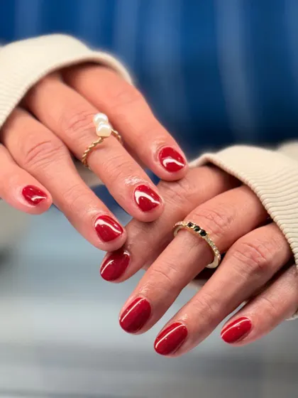 The full view of the classic red manicure. The high-gloss finish and perfect application make this simple look absolutely stunning.