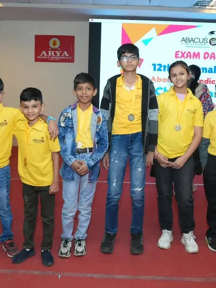 A group of my students in their yellow academy t-shirts, proudly showing off their medals. They are all champions in my eyes.