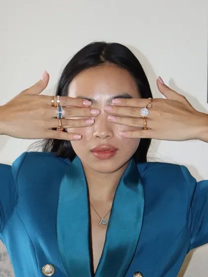 A playful shot showcasing a full stack of my custom rings and the personalized initial necklace. It’s all about creating a look that is an extension of your personality.