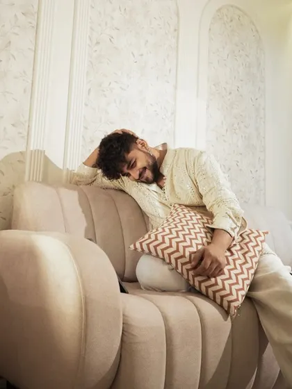 A candid moment from the shoot. This ivory kurta is not just stylish but also comfortable, perfect for embodying relaxed elegance.