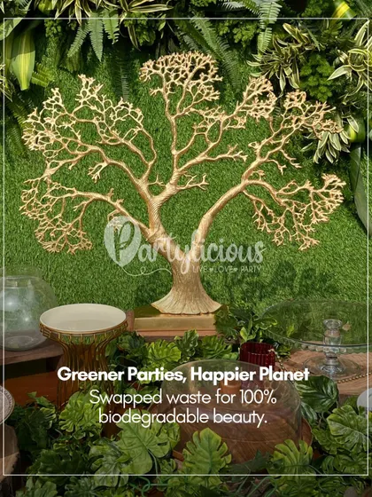 Greener parties make for a happier planet. This setup features a beautiful golden tree against a lush green backdrop, symbolizing my commitment to using 100% biodegradable and reusable elements in my designs.
