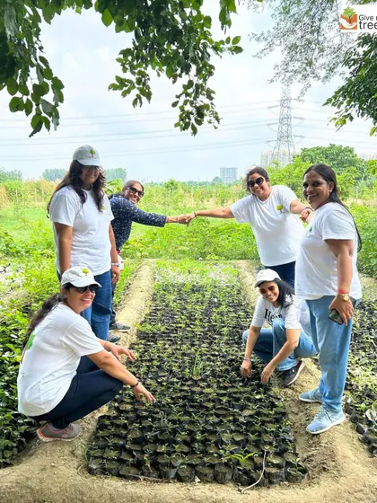 A group of dedicated volunteers, mostly women, taking part in a plantation event. Their commitment is helping us grow a green legacy, and they are true eco-heroes building a more sustainable future.