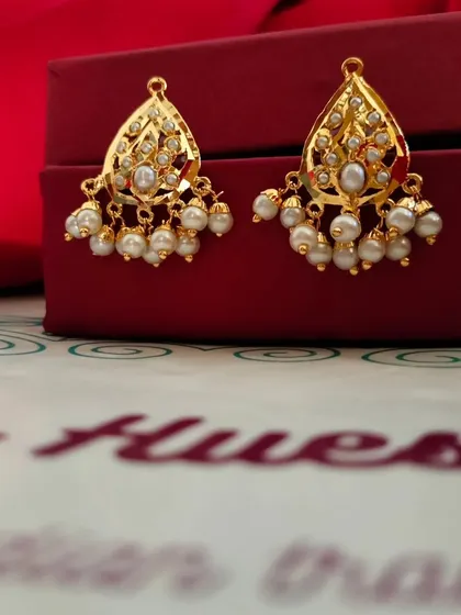 A slightly different angle of the "Kali" earrings, showing the fine detail of the gold work and the quality of the pearls. These are a wonderful gift that feels both traditional and stylish.