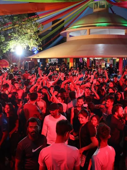 Another angle of the huge crowd at Wonderla, this time bathed in red light. The energy was non-stop.