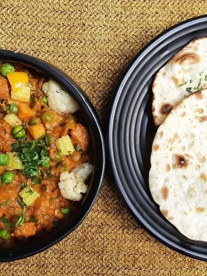 Savour the flavours and unwind at Garden Court. It's where good food like this Subz Dum Matka and Kulcha meets great vibes.