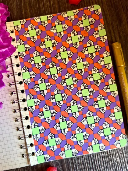 My kind of therapy. A vibrant geometric pattern in purple, orange, and green. This is what I do to quiet my mind.