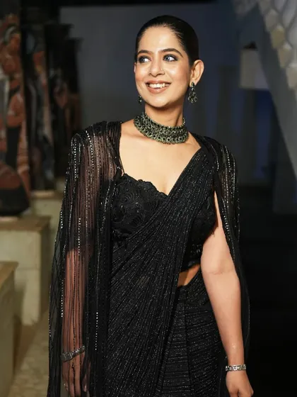 A pre-show shot before hosting the Encalm annual event. I believe in dressing for the occasion, and this elegant black saree was perfect for a sophisticated corporate evening.