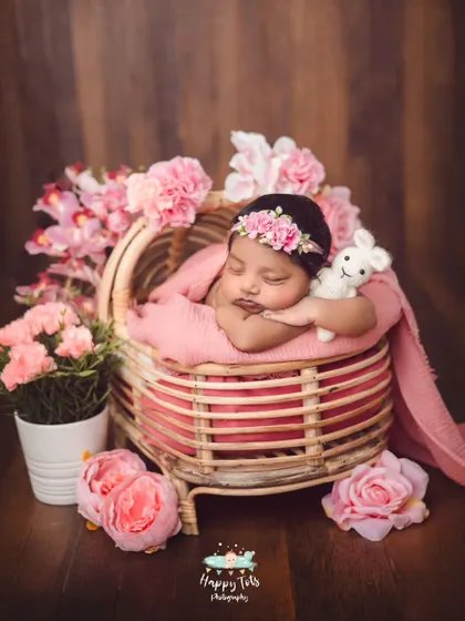 So much sweetness in one photo. This baby girl is posed with her little stuffed animal, adding a personal and adorable touch to her newborn portraits.