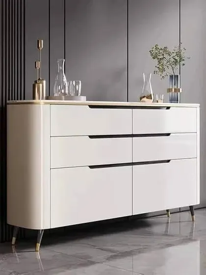 A sleek and modern console unit with clean lines, handleless drawers, and elegant tapered legs, shown here in a white finish.