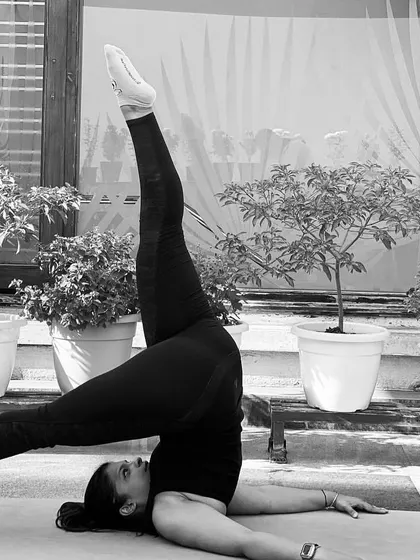 This is a variation of Sarvangasana, or Shoulder Stand. Inversions like this are great for increasing blood flow to the brain and calming the nervous system.