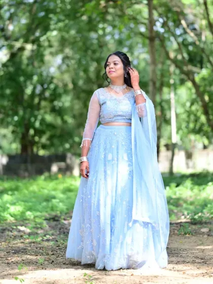 A client looking lovely in a powder blue lehenga. This is a great rental option for a daytime event or a pre-wedding function, with its light color and delicate embroidery.