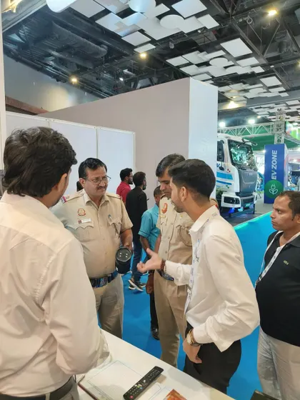 Explaining my technology to members of the police force at the IEC GM Exhibition. Their feedback is invaluable in designing products that meet real-world law enforcement needs.