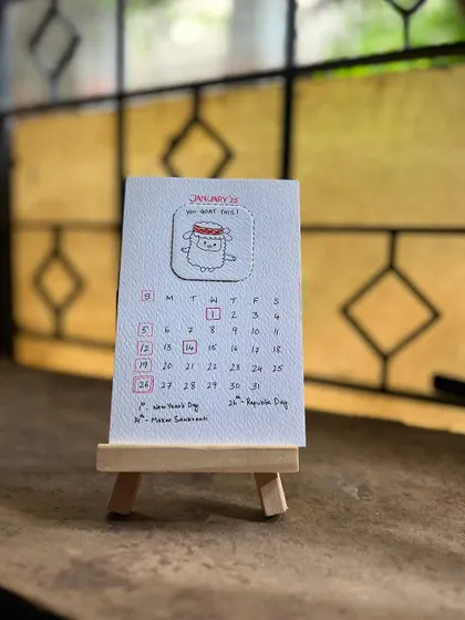 A close-up of the January 2025 calendar page, showing the hand-drawn details and textured paper.