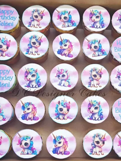 Perfect for a unicorn-themed party, this large set of cupcakes features adorable, edible unicorn prints. I also added personalized "Happy Birthday" toppers to make them extra special.