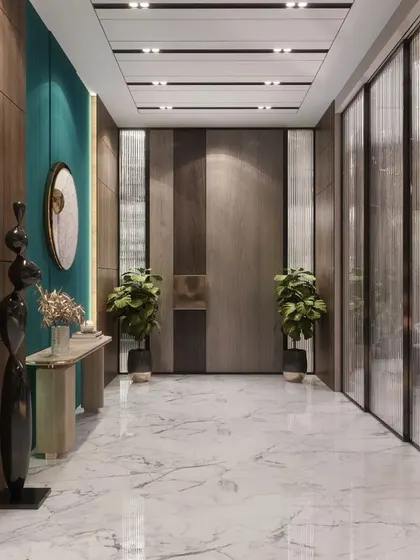 The entrance corridor is crucial in setting the vibe of a space. Here, we used a combination of wood paneling, fluted glass, and marble flooring to create a luxurious and dramatic passageway that builds anticipation for the rooms beyond.