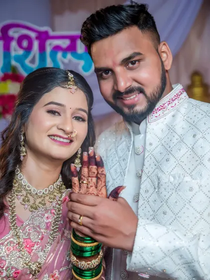 The happy couple proudly displays the bride-to-be's hand with her new engagement ring. A perfect shot to announce the wonderful news.