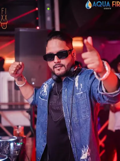 The party doesn't start until I say so. A shot of me getting the crowd hyped up at The Fixx Bar, ready to drop another banger.