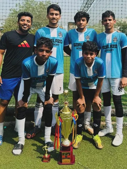 Another trophy for the collection. Our players and coach posing after a successful tournament run.