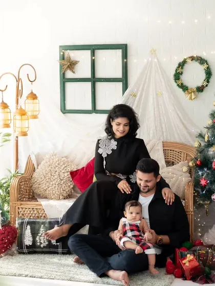 A perfect family Christmas card photo. This family portrait captures the warmth and joy of the holiday season in our festive studio setup.