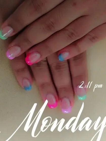 A playful and modern twist on the French manicure, with each nail tip painted in a different bright, neon color. This is a great way to add a pop of fun to your look.