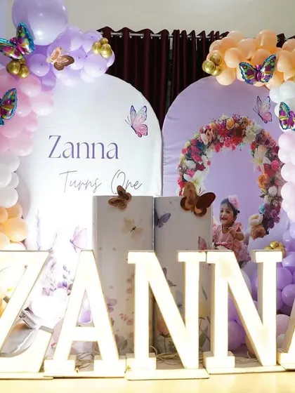 Another angle of Zanna's party, showing the light-up number '1' and the delicate butterfly details scattered throughout the balloon arrangements.