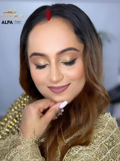 A detailed shot of the eye makeup, with a clean winged liner that lifts and defines the eyes.