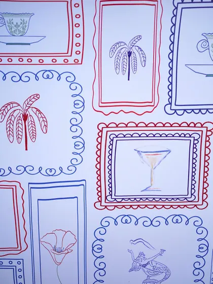 A close-up of the whimsical doodle-art fabric, a unique and personalized element of the Revival Lunch.