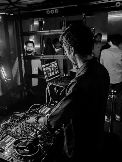 A black and white shot focusing on my concentration while mixing. You can see my reflection in the glass.