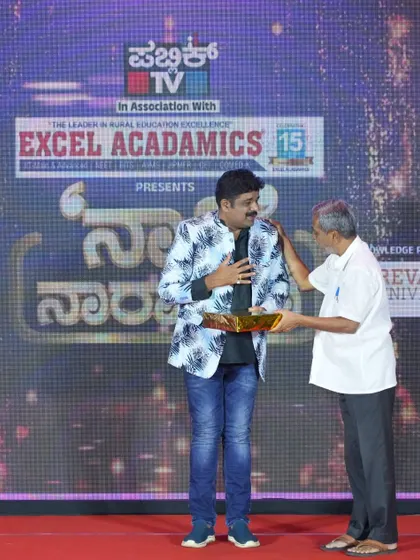 Receiving a felicitation from Ranganna sir at a Public TV event for Excel Acadamics. I am thankful to the organizers for this honor.